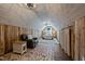 Unique bonus room with hardwood floors, wooden shiplap, and space to relax and unwind at 4420 Bunton Swaim Rd, Liberty, NC 27298