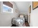 Light-filled bedroom featuring a bed with a metal frame and a window view at 4420 Bunton Swaim Rd, Liberty, NC 27298