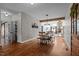 Open-concept dining area with brick accent wall, seamlessly connecting to the living room at 4420 Bunton Swaim Rd, Liberty, NC 27298