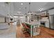 Spacious kitchen featuring an island with barstool seating and modern stainless steel appliances at 4420 Bunton Swaim Rd, Liberty, NC 27298