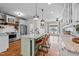 Spacious kitchen featuring a large island with barstool seating and modern stainless steel appliances at 4420 Bunton Swaim Rd, Liberty, NC 27298