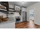 Bright kitchen with granite counters, stainless steel appliances, and hardwood floors at 4420 Bunton Swaim Rd, Liberty, NC 27298
