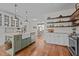 Open kitchen featuring a large island with barstool seating and stainless steel appliances at 4420 Bunton Swaim Rd, Liberty, NC 27298