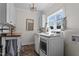 Bright laundry room with modern appliances, wood countertops, and ample natural light at 4420 Bunton Swaim Rd, Liberty, NC 27298