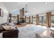 Bright living room with a vaulted ceiling, wood-burning fireplace, and neutral decor at 4420 Bunton Swaim Rd, Liberty, NC 27298
