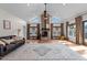Bright living room boasting high vaulted ceilings, a brick fireplace, and large windows at 4420 Bunton Swaim Rd, Liberty, NC 27298