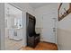 Inviting mudroom featuring an antique coat rack and convenient access to the laundry area at 4420 Bunton Swaim Rd, Liberty, NC 27298
