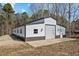 Large outbuilding features a roll up door for easy access at 4420 Bunton Swaim Rd, Liberty, NC 27298