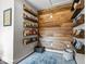 Charming reading nook with wooden shelves, wood accent wall, and a blue rug at 4420 Bunton Swaim Rd, Liberty, NC 27298