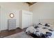 Bedroom view features a wardrobe, dresser, modern bed frame with floral bedding and wood-look floors at 500 N Duke St # 53104, Durham, NC 27701