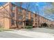 Brick condominium building exterior featuring covered entrances and well-manicured landscaping at 500 N Duke St # 53104, Durham, NC 27701
