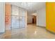 Spacious hallway with brick accent wall, metal doors, polished floors, and industrial-style lighting at 500 N Duke St # 53104, Durham, NC 27701
