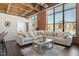 Spacious living room with an oversized sectional sofa and plenty of natural light at 500 N Duke St # 53104, Durham, NC 27701