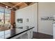 Bright living area has large windows, exposed brick, and modern decor at 500 N Duke St # 53104, Durham, NC 27701