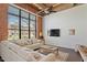 Cozy living room with exposed brick and ample natural light, with open-concept kitchen at 500 N Duke St # 53104, Durham, NC 27701