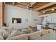 Inviting living room with modern decor and exposed beams leading to the kitchen at 500 N Duke St # 53104, Durham, NC 27701