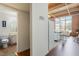Open-concept living space with exposed brick, beamed ceilings, and large windows to allow natural light at 500 N Duke St # 53104, Durham, NC 27701