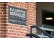 Close up of the sign for the Bullington Warehouse Condominiums featuring entrance for numbers 53 and 54 at 500 N Duke St # 53104, Durham, NC 27701