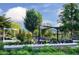 Scenic view of Downtown Cary Park, showcasing lush landscaping and modern design elements at 600 Hedrick Ridge Road # 306, Cary, NC 27519