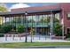 Frontal view of Cary Regional Library featuring a modern glass facade and brick architecture at 600 Hedrick Ridge Road # 306, Cary, NC 27519