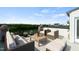 Inviting rooftop deck with comfortable seating, scenic views, and lush planters for relaxing or entertaining guests at 600 Hedrick Ridge Road # 306, Cary, NC 27519