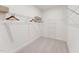 Walk-in closet with ample storage space and shelving, providing an organized and efficient storage solution at 600 Hedrick Ridge Road # 312, Cary, NC 27519