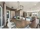 Dining room featuring a modern light fixture and view into the kitchen at 600 Hedrick Ridge Road # 312, Cary, NC 27519