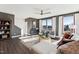 Bright living room featuring large windows, modern decor, and hardwood floors at 600 Hedrick Ridge Road # 312, Cary, NC 27519
