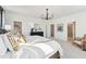 Bright bedroom with white walls, complemented by a modern chandelier and a comfortable sitting area at 600 Hedrick Ridge Road # 312, Cary, NC 27519