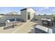 Spacious rooftop deck perfect for entertaining with plush seating and an outdoor dining area at 600 Hedrick Ridge Road # 312, Cary, NC 27519