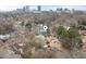 Aerial view of a charming neighborhood, featuring a green home with downtown in the background at 603 Polk St, Raleigh, NC 27604