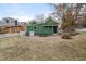 Green house with backyard, patio, and table set with chairs at 603 Polk St, Raleigh, NC 27604