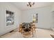 Bright dining room with large windows, a modern table, and a decorative chandelier at 603 Polk St, Raleigh, NC 27604