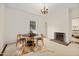 Elegant dining room with a fireplace, large windows, and classic accents at 603 Polk St, Raleigh, NC 27604