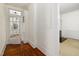 Hallway featuring hardwood floors, a stylish front door, and access to other rooms at 603 Polk St, Raleigh, NC 27604