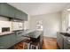 Bright kitchen with stainless steel gas range, island and hardwood floors at 603 Polk St, Raleigh, NC 27604