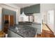 Modern kitchen features sleek cabinetry, stainless steel appliances, and a stunning black marble island at 603 Polk St, Raleigh, NC 27604