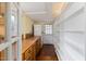 Laundry room with washer, dryer, wood counters, shelving, and natural light at 603 Polk St, Raleigh, NC 27604