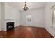 Spacious living room features hardwood floors, a fireplace, and natural light at 603 Polk St, Raleigh, NC 27604