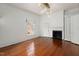 Bright living room with fireplace, hardwood floors, and modern lighting at 603 Polk St, Raleigh, NC 27604