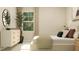 Bright bedroom featuring a large window, modern dresser, comfortable bed and neutral decor at 620 Vega Bluff Ln, Angier, NC 27501