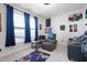 Cozy bedroom with neutral carpet, natural light, and a comfortable reading area at 624 Red Arrow Dr, Knightdale, NC 27545