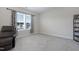 Bright bedroom featuring neutral walls, plush carpet, and large window with neighborhood views at 624 Red Arrow Dr, Knightdale, NC 27545