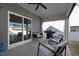 Spacious covered patio with barbecue, seating, and sliding door to backyard at 624 Red Arrow Dr, Knightdale, NC 27545