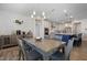 Dining area showcasing modern lighting fixtures and access to an open-concept kitchen at 624 Red Arrow Dr, Knightdale, NC 27545