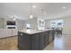Open concept kitchen featuring a large island with stainless steel appliances and modern finishes at 624 Red Arrow Dr, Knightdale, NC 27545