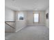 Bright loft area features neutral walls, carpeted flooring, and natural light from the two windows at 624 Red Arrow Dr, Knightdale, NC 27545
