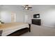 Bedroom features neutral walls, carpeted floors, a ceiling fan, and a large dresser at 624 Red Arrow Dr, Knightdale, NC 27545