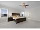 Bright main bedroom features neutral walls, carpeted floors, ceiling fan, and natural light at 624 Red Arrow Dr, Knightdale, NC 27545