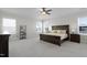 Spacious bedroom features neutral walls, large windows, ceiling fan, and carpeted floors at 624 Red Arrow Dr, Knightdale, NC 27545